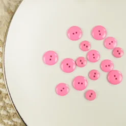 Bouton brillant polyester rose