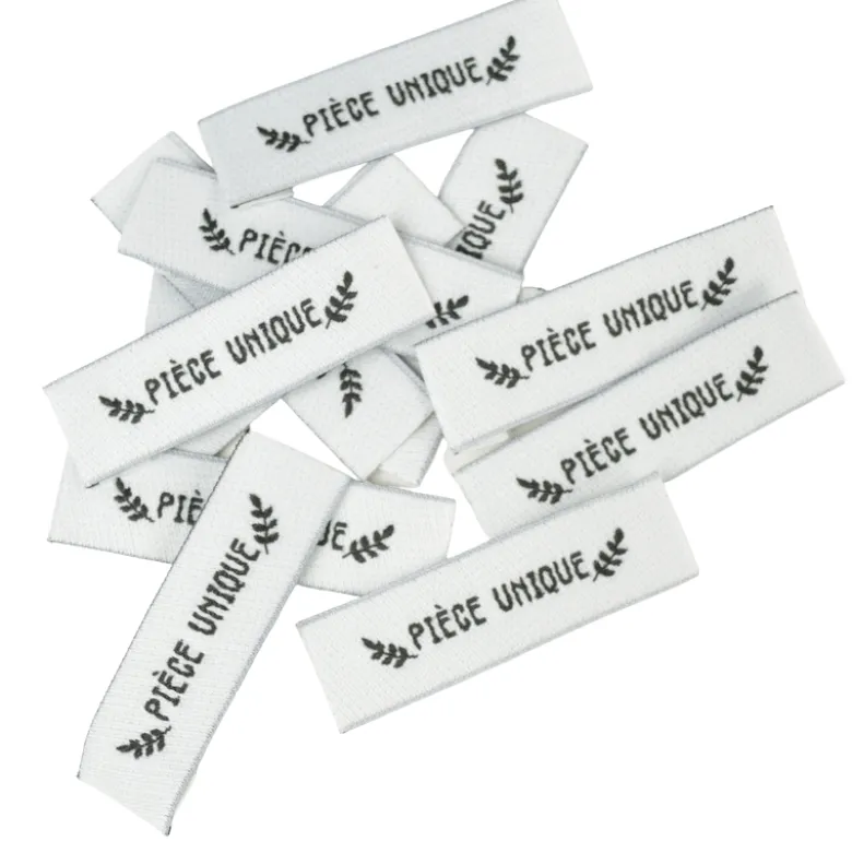 Etiquette tissée pré-pliée à coudre message "PIECE UNIQUE" 14x48mm