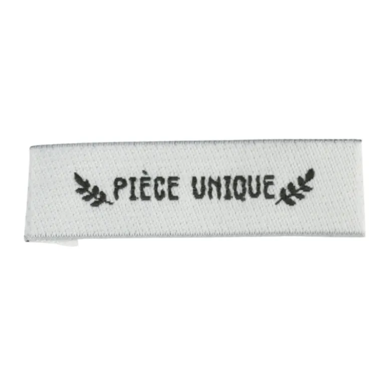 Etiquette tissée pré-pliée à coudre message "PIECE UNIQUE" 14x48mm
