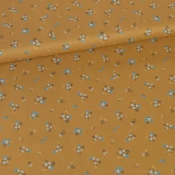Popeline de coton Bisou motif fleurs bleues fond Ocre