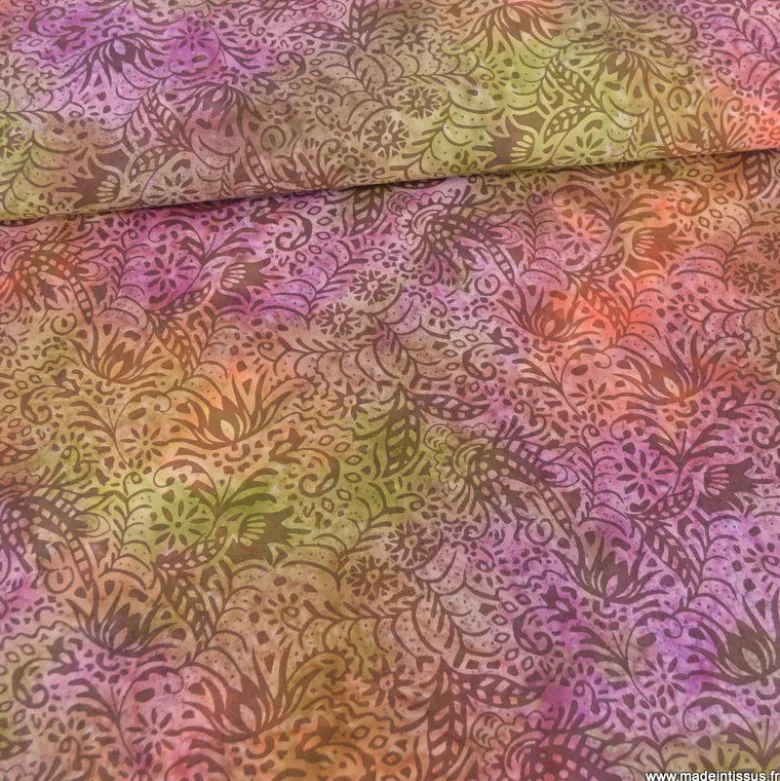 Tissu Batik fond motifs fleuris violet, vert et orange