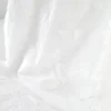 Tissu coton brodé blanc à fleurs frangées