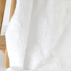 Tissu coton brodé blanc à fleurs frangées