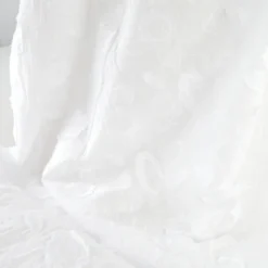 Tissu coton brodé blanc à fleurs frangées