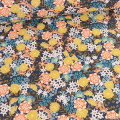 Tissu coton Enduit Akemi motifs fleurs fond marine