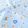 Tissu coton Enduit Joe motif carreaux bleus et blanc et animaux