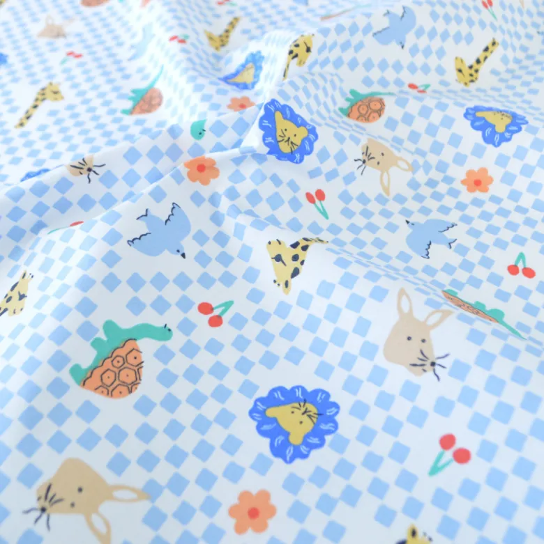 Tissu coton Enduit Joe motif carreaux bleus et blanc et animaux
