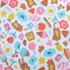 Tissu coton enduit Kawi motifs kawaii multicolores