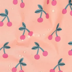 Tissu coton Enduit motifs cerises fond rose