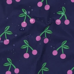 Tissu coton Enduit motifs cerises fond bleu marine