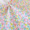 Tissu coton Enduit Thalie motif fleurs roses et jaunes
