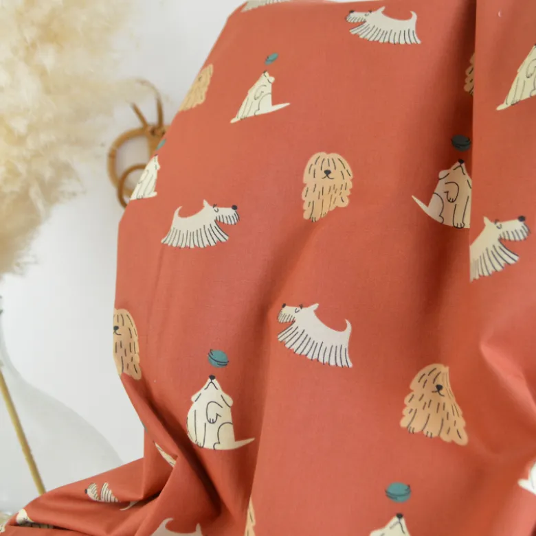 Tissu coton imprimé chiens fond terracotta - OEKO TEX