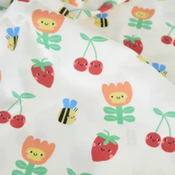Tissu coton imprimé fleurs et fruits enfantins fond blanc cassé - OEKO TEX