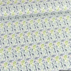 Tissu coton Lion motif petites feuilles exotiques vertes fond blanc
