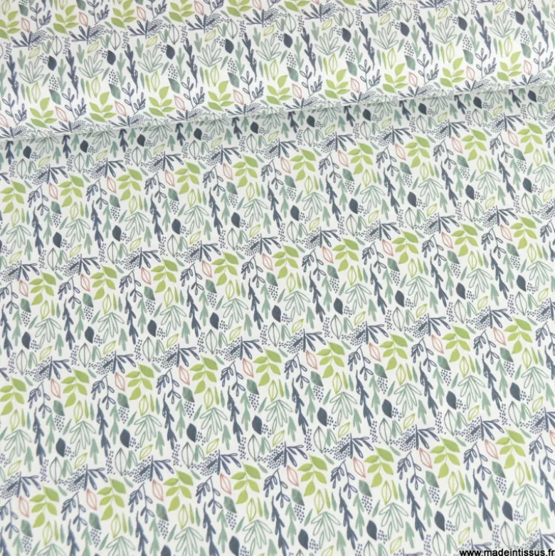 Tissu coton Lion motif petites feuilles exotiques vertes fond blanc