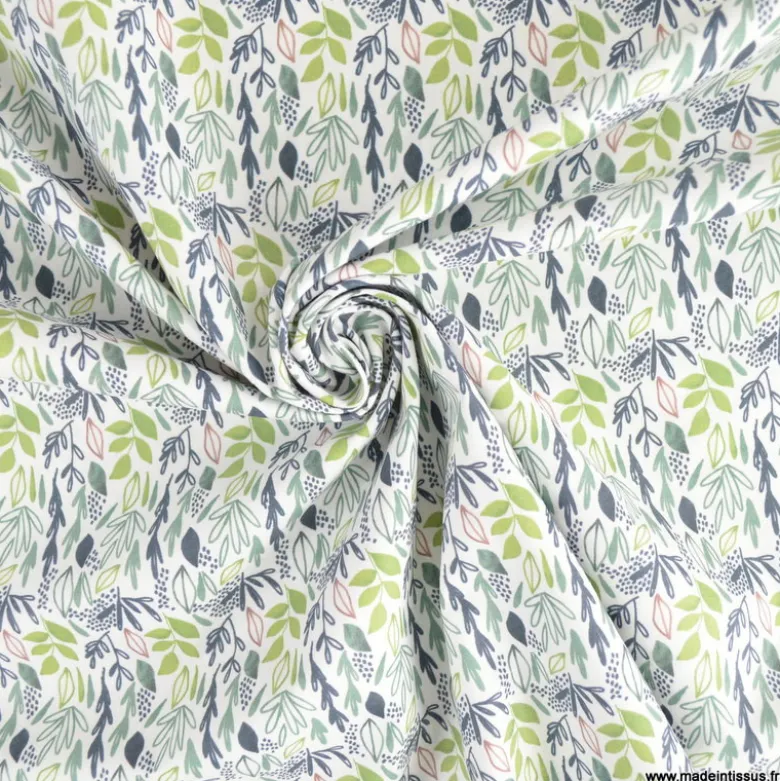 Tissu coton Lion motif petites feuilles exotiques vertes fond blanc