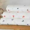 Tissu coton motif bateaux fond blanc cassé - OEKO TEX