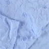 Tissu coton à ratyures Octave motif fleurs en relief