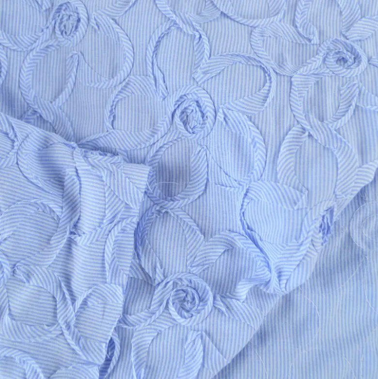 Tissu coton à ratyures Octave motif fleurs en relief