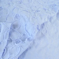 Tissu coton à ratyures Octave motif fleurs en relief