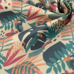 Tissu coton Tahoe motif perroquets et feuilles exotiques pétrole