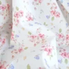 Tissu cretonne coton Amael motif fleurs roses fond écru - OEKO TEX