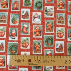 Tissu cretonne coton Noël motif timbres vintage fond rouge