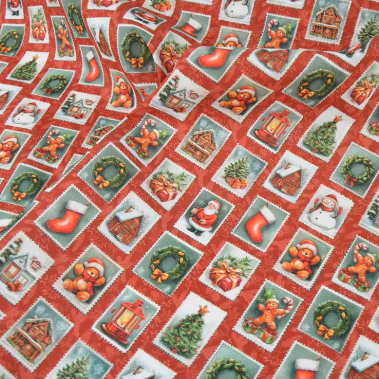 Tissu cretonne coton Noël motif timbres vintage fond rouge