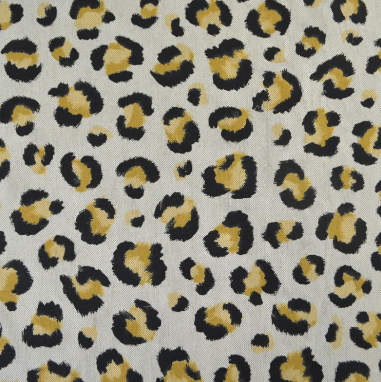 Tissu demi natté coton motif léopard doré fond aspect lin