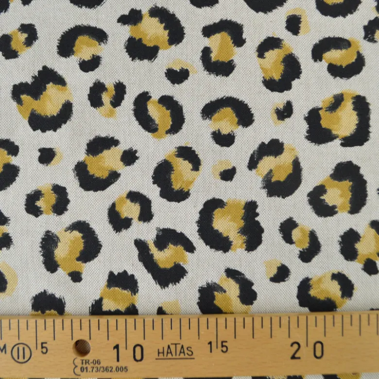 Tissu demi natté coton motif léopard doré fond aspect lin