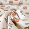 Tissu demi-natté motif fleurs orange fond écru