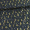 Tissu de Noël motif foret de sapins et étoiles or fond bleu marine - OEKO TEX