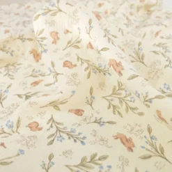 Tissu double gaze de coton Ariella lapins & feuillage fond écru