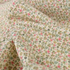 Tissu double gaze de coton Caseille fleurs rose fluo fond écru