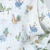 Tissu double gaze de coton Ceradino motif dinosaures fond à carreaux blanc