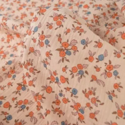 Tissu double gaze de coton June fleurs fond rose skin