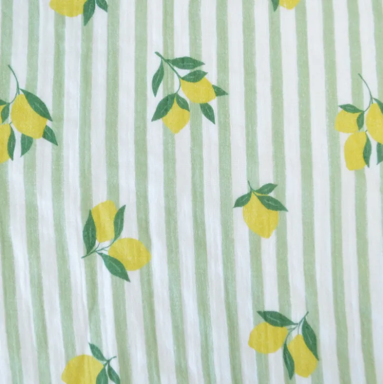 Tissu double gaze de coton Limoncello motif citrons et rayures Amande