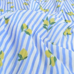 Tissu double gaze de coton Limoncello motif citrons et rayures bleues