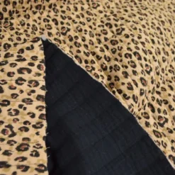 Tissu double gaze de coton matelassé léopard beige envers noir