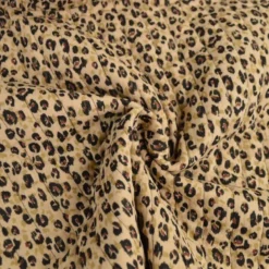 Tissu double gaze de coton matelassé léopard beige envers noir