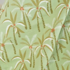 Tissu double gaze de coton Paloum motif palmiers fond amande