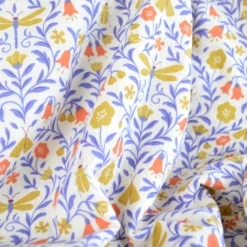 Tissu double gaze de coton Scarabée motif feuillage, papillons et scarabée