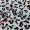 Tissu double gaze motif léopard multi fond blanc cassé - OEKO TEX