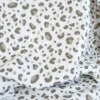 Tissu double gaze motif léopard taupe fond blanc cassé - OEKO TEX