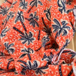 Tissu double gaze motif palmier et fond leopard corail - OEKO TEX