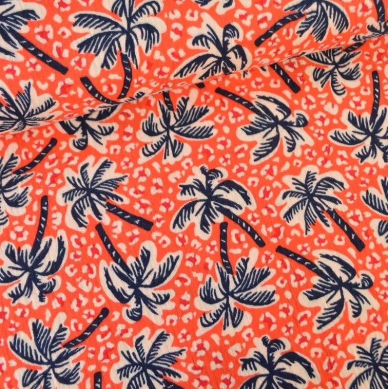 Tissu double gaze motif palmier et fond leopard corail - OEKO TEX