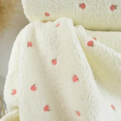 Tissu Fausse Fourrure Sherpa brodée pêches - Ecru