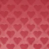 Tissu fausse fourrure structurée motif coeurs - Rose corail