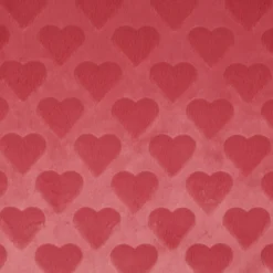 Tissu fausse fourrure structurée motif coeurs - Rose corail