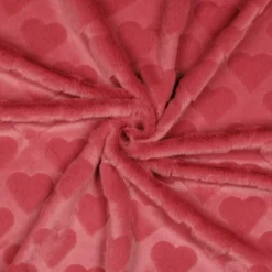 Tissu fausse fourrure structurée motif coeurs - Rose corail